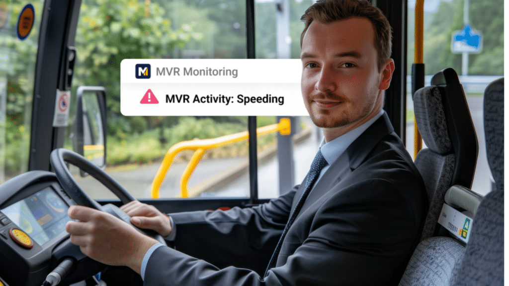A man in a suit sits in the driver’s seat of a bus. Onscreen text reads MVR Monitoring and MVR Activity: Speeding with a warning icon.